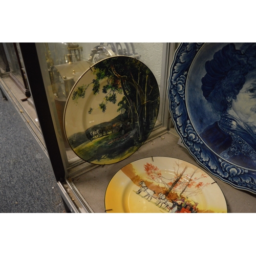 595 - Decorative plates to include Doulton and others and a large colourful charger.