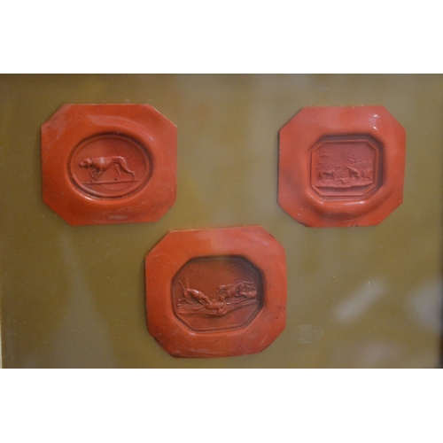 596 - Six wax seals housed in two framed and glazed cases.