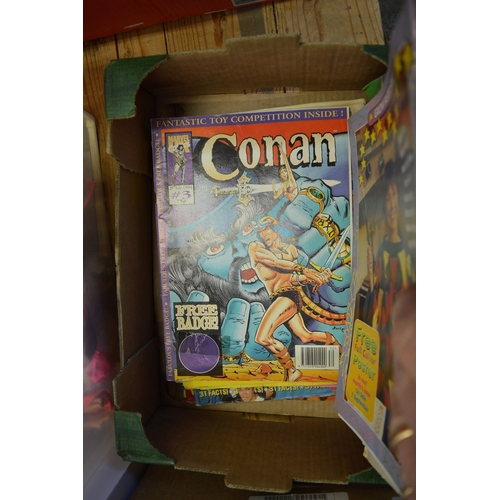 72 - A box of comics.