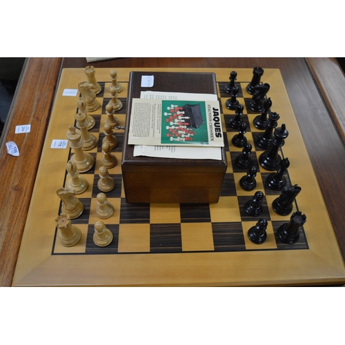 775 - A Jaques Staunton chess set and board.