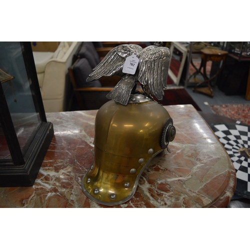 782 - A large Prussian brass and leather helmet with eagle mount.