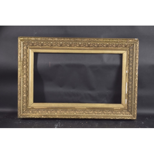 13 - A FRENCH SLOPE 4.25INS GILTWOOD PICTURE FRAME. Rebate size 14.5ins X 24ins