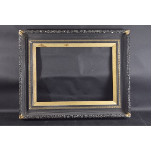 17 - A BLACK REEDED FRAME with Greek key pattern. Rebate size 20ins x 27ins