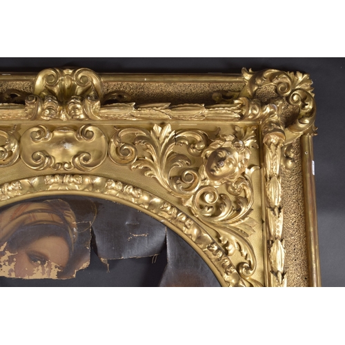 21 - A FLORENTINE CARVED AND GILDED PICTURE FRAME Circular aperture of diameter 28.25