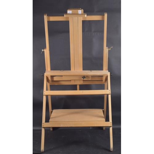 22 - AN ARTISTS EASEL BY LOXLEY and two folio stands