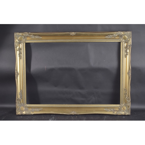 9 - A GILT PICTURE FRAME Rebate size 20ins x 30ins.