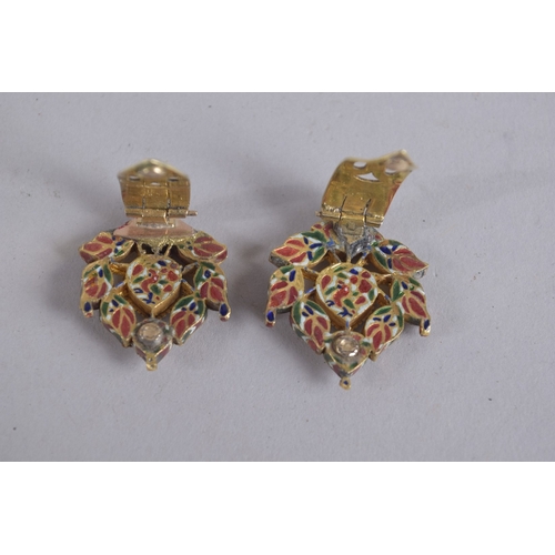 125 - A PAIR OF 19TH CENTURY INDIAN ENAMELLED GOLD EARRINGS, set with clear stones.