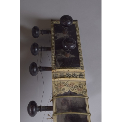 133 - A VERY FINE 19TH CENTURY INDIAN BONE MOUNTED SITAR MUSICAL INSTRUMENT, 12.5cm long.