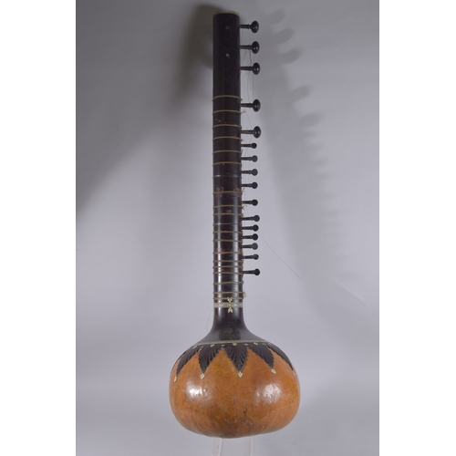 133 - A VERY FINE 19TH CENTURY INDIAN BONE MOUNTED SITAR MUSICAL INSTRUMENT, 12.5cm long.