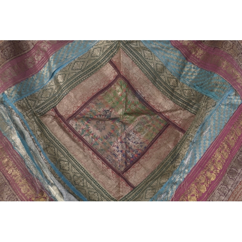 208 - A 19TH-20TH CENTURY INDIAN MULTICOLOURED SILK FABRIC, 76cm x 74cm.