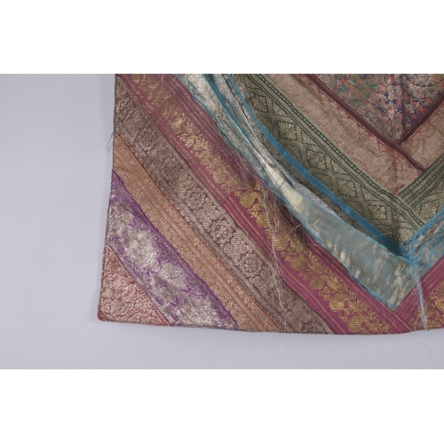 208 - A 19TH-20TH CENTURY INDIAN MULTICOLOURED SILK FABRIC, 76cm x 74cm.