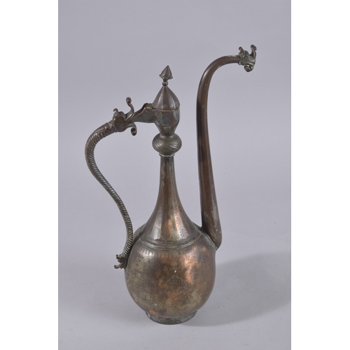 240 - A 17TH-18TH CENTURY LATE SAFAVID TINNED COPPER EWER, 43cm high.