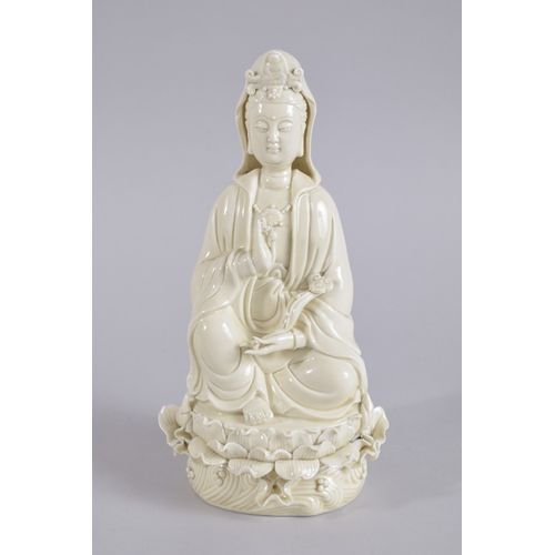 36 - AN EARLY 20TH CENTURY DEHUA PORCELAIN GUANYIN, with two impressed seal marks to the reverse, 27cm hi... 