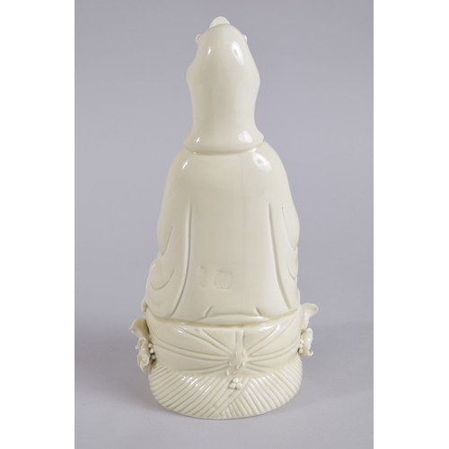 36 - AN EARLY 20TH CENTURY DEHUA PORCELAIN GUANYIN, with two impressed seal marks to the reverse, 27cm hi... 