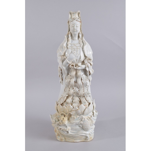 37 - A LARGE 20TH CENTURY CHINESE QINGBAI POTTERY GUANYIN, 51cm high.