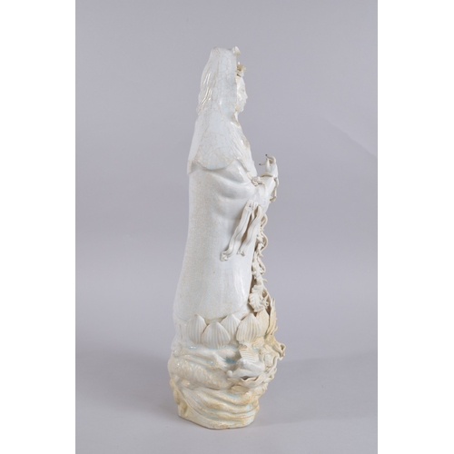 37 - A LARGE 20TH CENTURY CHINESE QINGBAI POTTERY GUANYIN, 51cm high.