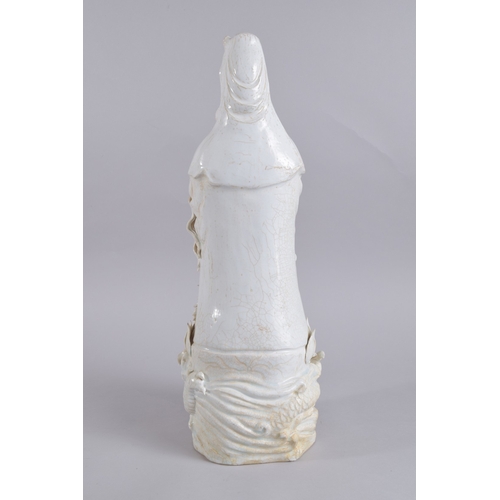 37 - A LARGE 20TH CENTURY CHINESE QINGBAI POTTERY GUANYIN, 51cm high.