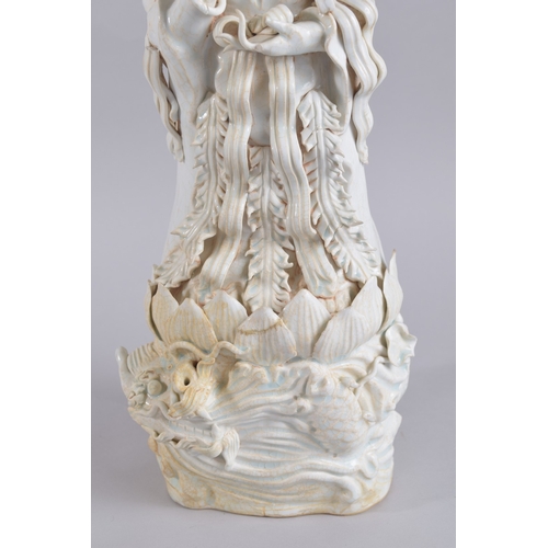 37 - A LARGE 20TH CENTURY CHINESE QINGBAI POTTERY GUANYIN, 51cm high.