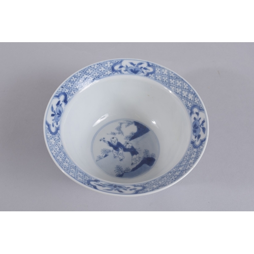 42 - A CHINESE KANGXI PERIOD BLUE AND WHITE PORCELAIN BOWL, painted with female figures and boys, the bas... 