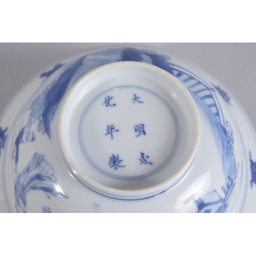 42 - A CHINESE KANGXI PERIOD BLUE AND WHITE PORCELAIN BOWL, painted with female figures and boys, the bas... 