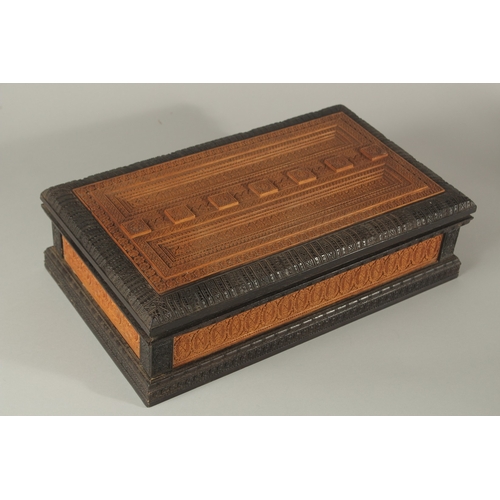 437 - A VERY FINE LARGE 19TH CENTURY SRI LANKAN EBONY AND POSSIBLY SANDALWOOD ENGRAVED CASKET, 40cm x 24cm... 