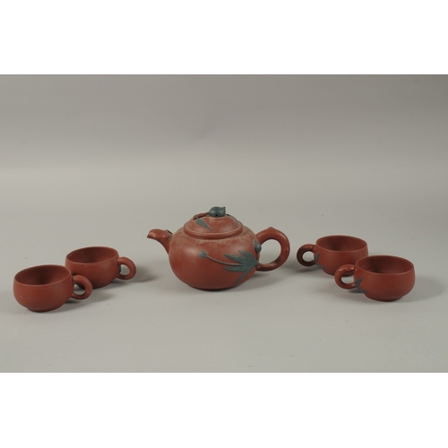 452 - A CHINESE YIXING TEA SET, comprising a teapot and four tea cups (one broken), each piece with impres... 