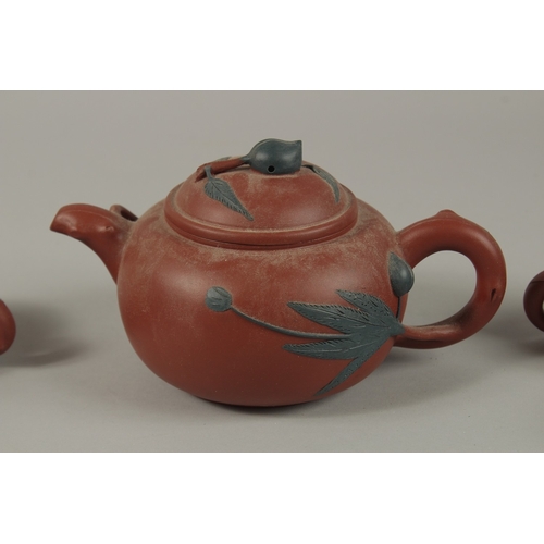 452 - A CHINESE YIXING TEA SET, comprising a teapot and four tea cups (one broken), each piece with impres... 