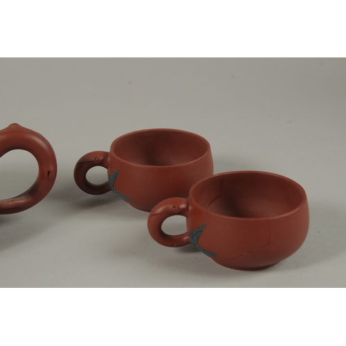 452 - A CHINESE YIXING TEA SET, comprising a teapot and four tea cups (one broken), each piece with impres... 