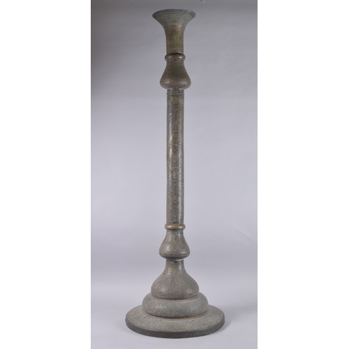 435 - AN ISLAMIC SYRIAN OPENWORKED BRASS TORCH STAND / FLOOR LAMP, with panels of calligraphy, 153cm high.