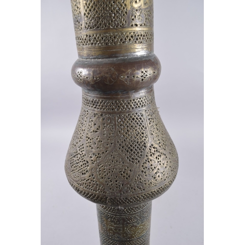 435 - AN ISLAMIC SYRIAN OPENWORKED BRASS TORCH STAND / FLOOR LAMP, with panels of calligraphy, 153cm high.