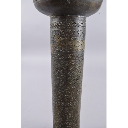 435 - AN ISLAMIC SYRIAN OPENWORKED BRASS TORCH STAND / FLOOR LAMP, with panels of calligraphy, 153cm high.