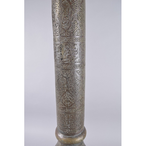 435 - AN ISLAMIC SYRIAN OPENWORKED BRASS TORCH STAND / FLOOR LAMP, with panels of calligraphy, 153cm high.