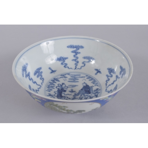 44 - A CHINESE DAOGUANG BLUE GROUND FAMILLE ROSE PORCELAIN MEDALLION BOWL, mark and period, the exterior ... 