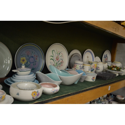 650 - A good collection of Poole pottery to include plates, bowls, jugs, hors d'oeuvres dishes etc.