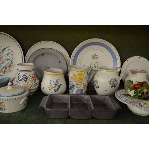 650 - A good collection of Poole pottery to include plates, bowls, jugs, hors d'oeuvres dishes etc.