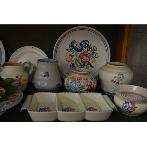 650 - A good collection of Poole pottery to include plates, bowls, jugs, hors d'oeuvres dishes etc.