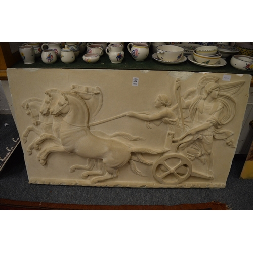 654 - A moulded plaster plaque of a centurian and chariot.