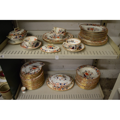 76 - A Spode part dinner service decorated in Imari colours (some faults).