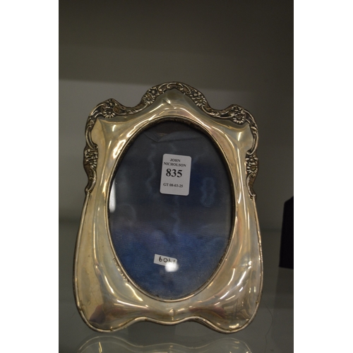 835 - A silver photograph frame.