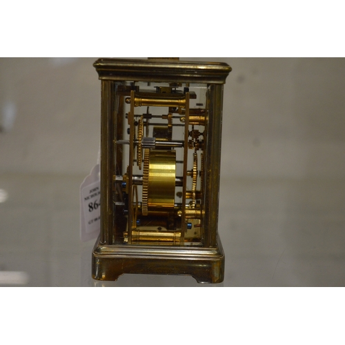 864 - A brass carriage clock with alarm.