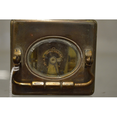 864 - A brass carriage clock with alarm.