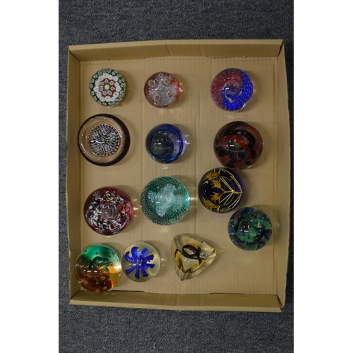 868 - A collection of glass paperweights.