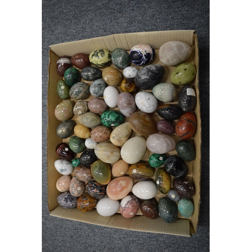 869 - A collection of hard stone eggs.