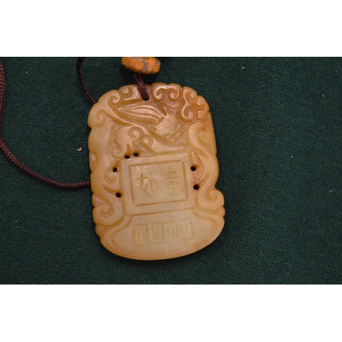 971 - A Chinese jadeite pendant.