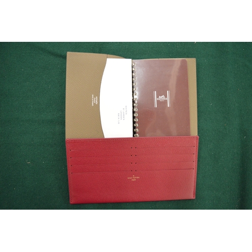 982 - A Hermes leather cased note pad and a Louis Vuitton red leather credit card holder.