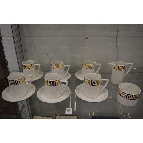 995 - A set of six Portmeirion coffee cups and saucers, white ground with gilt Greek key border, together ... 