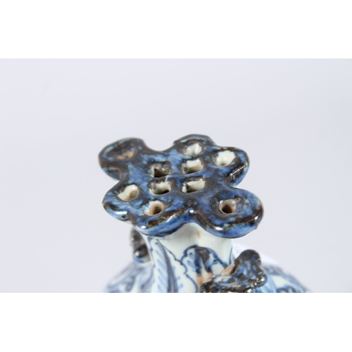 122 - A CHINESE PORCELAIN BLUE AND WHITE VASE of moulded form, with pierced flower stem neck, painted with... 