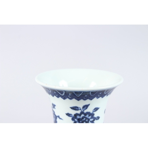 123 - A CHINESE PORCELAIN BLUE AND WHITE GU SHAPE VASE, painted with phoenix and flowers. 21.5cms high.... 
