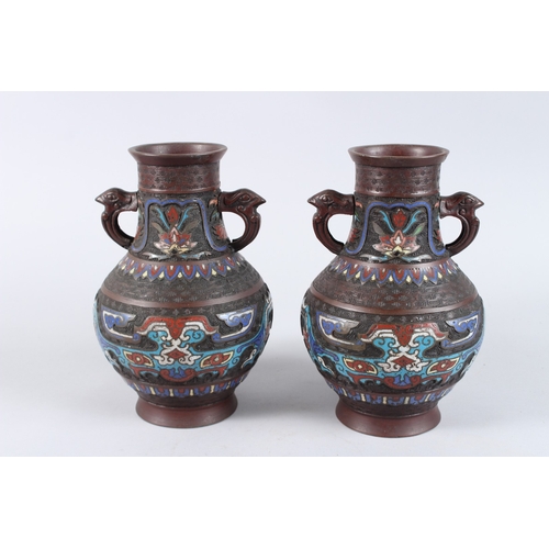 134 - A PAIR OF CHINESE BRONZE AND CLOISONNE TWO HANDLED VASES. 10ins high.
