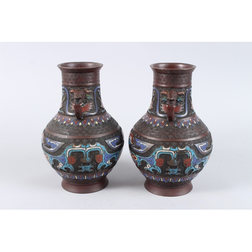 134 - A PAIR OF CHINESE BRONZE AND CLOISONNE TWO HANDLED VASES. 10ins high.